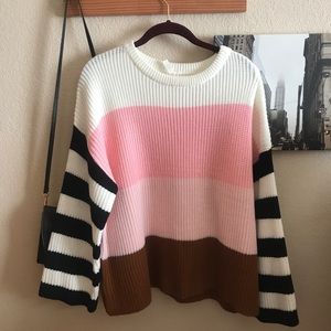 Striped pink, brown and black sweater.
